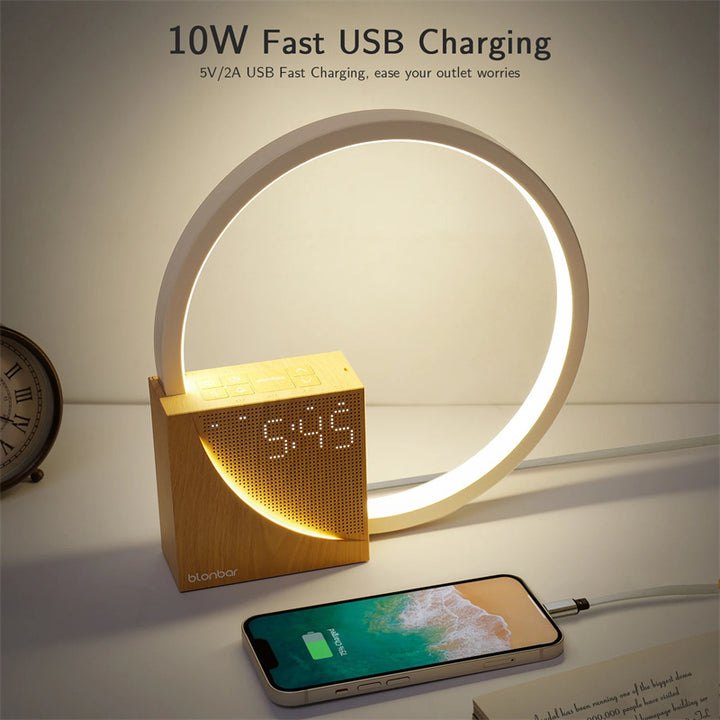 Smart clock with round LED light and smartphone on a table, featuring 10W fast USB charging.