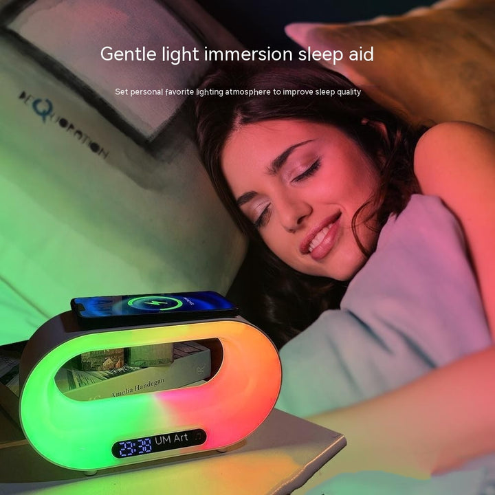 Woman lying in bed with a colorful light display device on her nightstand, labeled as a 'Gentle light immersion sleep aid'.